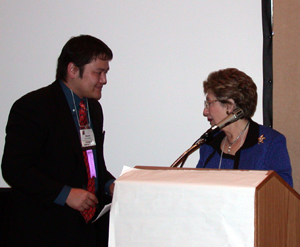 JALT's Steven Nishida receives Virginia French Allen award, on behalf of Mary Goebel Noguchi, from Penny Alatis