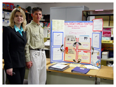 Irene Simonenko, ESL teacher, and her friend Franco, showing her poster about the ESL Newcomers Program in Omaha Public Schools (Photo credit: Judy Pape)