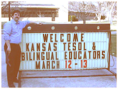 Robb Scott, Conference Chair, at the welcome sign in front of Memorial Union