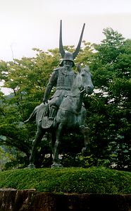 Photo by Harold Melville, of the statue of Ii Naomas, First Lord of Hikone Han, in front of Hikone Station